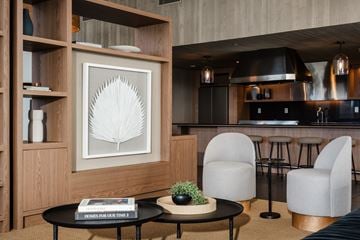 Marina Del Rey apartment for rent - A modern living room with a black coffee table and a framed picture on the wall.