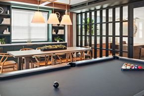Petaluma apartment for rent - a room with a pool table and a table with balls on it