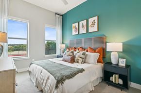 Dallas apartment for rent - a bedroom with a large bed and two windows