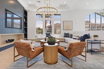 Chula Vista apartment for rent - A modern living room with a large window, a sofa set, and a coffee table.