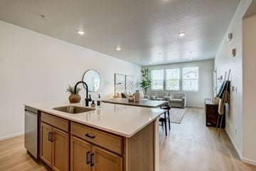 Fort Collins apartment for rent - A kitchen with wooden cabinets and a white countertop.