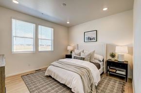 Fort Collins apartment for rent - Model bedroom at Bloom Rental Living apartments in Fort Collins, CO, featuring a window with blinds.