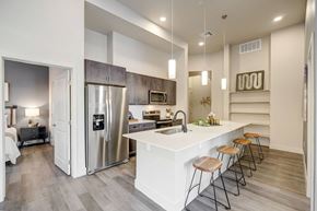 Colorado Springs apartment for rent - Kitchen with island, pendant lighting and built-in book shelving
