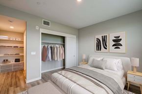 Morgan Hill apartment for rent - A bedroom with a large bed and a walk-in closet.