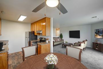 Concord apartment for rent - A kitchen with a table and chairs in the foreground.