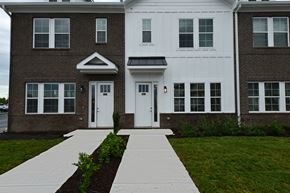 Lebanon apartment for rent - A white and brown building with a walkway in front.