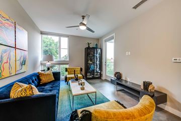 Los Angeles apartment for rent - A living room with a blue couch and a yellow chair.