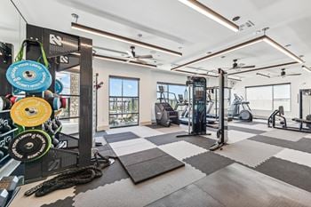 Two-level fitness space with superior cardio and strength training equipment, and a separate yoga/exercise room