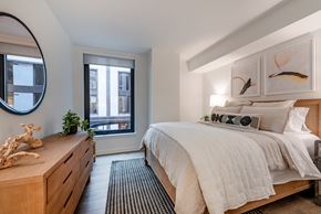 Washington apartment for rent - a bedroom with a bed and a dresser
