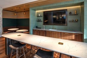Washington apartment for rent - a room with a long table with chairs and a television