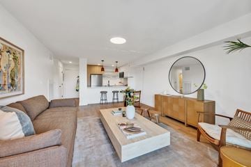 Newport Beach apartment for rent - A living room with a brown couch and a coffee table in the center.