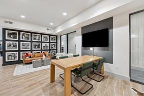 Austin apartment for rent - a conference room with a table and chairs and a television