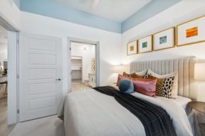 Austin apartment for rent - a bedroom with a bed and a door to a bathroom
