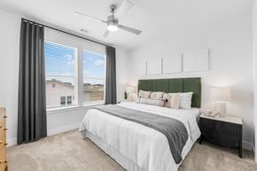 Georgetown apartment for rent - A bedroom with a large bed and a ceiling fan.