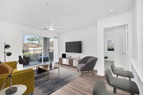 Manassas Park apartment for rent - a living room with a couch and a chair and a tv