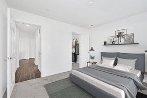 Manassas Park apartment for rent - an open bedroom with a bed and a closet