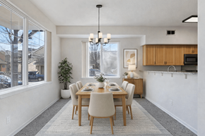 Boise apartment for rent - A dining room with a table set for six.