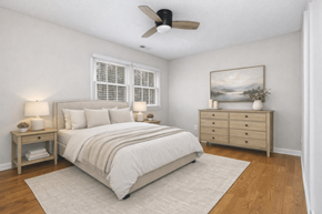 Chapel Hill apartment for rent - A bedroom with a bed, nightstand, and a painting on the wall.