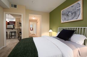 Santa Clara apartment for rent - a bedroom with a bed and a view of the kitchen and living room