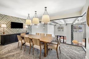 Ladson apartment for rent - A modern dining room with a wooden table and chairs.