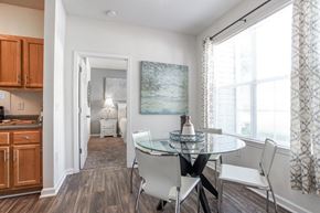 Stockbridge apartment for rent - A dining room with a glass table and chairs.