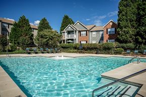 Stockbridge apartment for rent - Large swimming pool with trees at Eastwood Village Stockbridge apartments.
