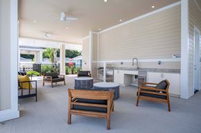 Wildwood triplex for rent - a patio with a table and chairs and a kitchen