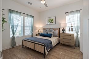 Wildwood triplex for rent - a bedroom with a bed and a dresser