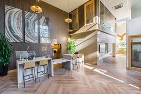 San Jose apartment for rent - a dining room with a table and stools in front of a large wall mural
