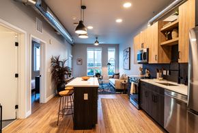 Denver apartment for rent - a kitchen and living room in an open floorplan apartment