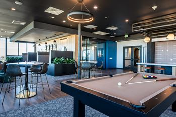 Chef’s kitchen and lounge with shuffleboard and billiards