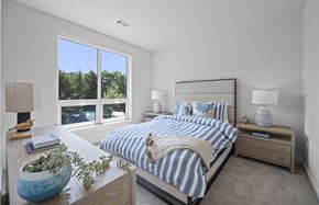Wilton apartment for rent - a bedroom with a bed and a large window