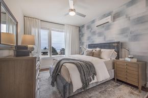 Revere apartment for rent - Furnished bedroom with ocean views, accent wall, ceiling fan and dresser