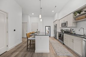Salem apartment for rent - A modern kitchen with a dining table and chairs.