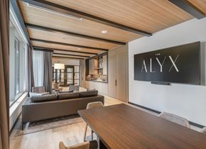 Boston apartment for rent - a conference room with a table and chairs and a tv on the wall
