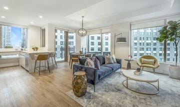 Boston apartment for rent - a living room with a couch and a table in front of a window