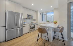 Boston apartment for rent - a kitchen with white cabinetry and stainless steel appliances