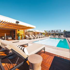 West Hollywood apartment for rent - rooftop swimming pool with lounge chairs
