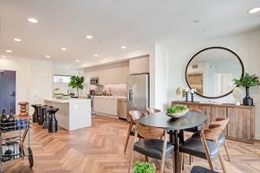 West Hollywood apartment for rent - a kitchen and dining area with a round table and chairs