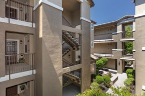 San Ramon apartment for rent - A view of a courtyard surrounded by buildings with balconies.