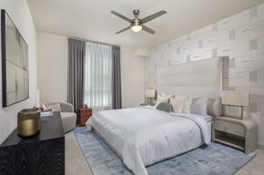 Los Angeles apartment for rent - A bedroom with a large bed and a ceiling fan.