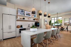Rancho Cucamonga apartment for rent - A modern kitchen with a dining table and chairs.