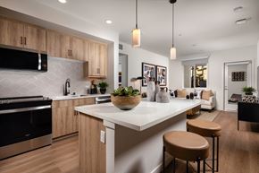 Chula Vista apartment for rent - A modern kitchen with wooden cabinets and a white island.