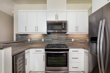 High-end kitchen w/ quartz countertops