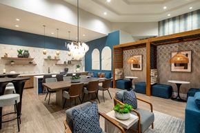 Palm Desert apartment for rent - A modern dining room with a wooden table and chairs.
