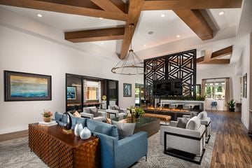 San Diego apartment for rent - A modern living room with a large sofa set and a fireplace.