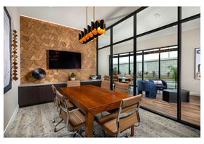 Inglewood apartment for rent - A modern dining room with a wooden table and chairs.