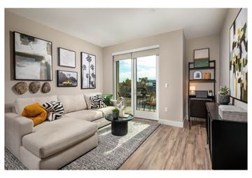 Inglewood apartment for rent - A living room with a white couch and a coffee table.