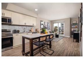 Inglewood apartment for rent - A kitchen with a table and chairs in the middle of the room.