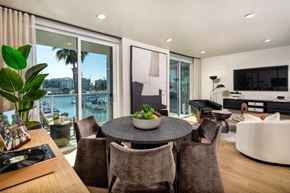 Marina Del Rey apartment for rent - A modern dining room with a table set for six and a view of the city.
